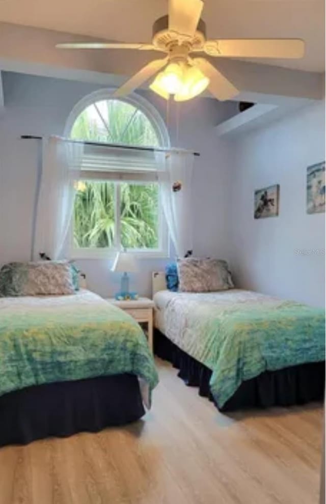 bedroom featuring hardwood / wood-style flooring and ceiling fan