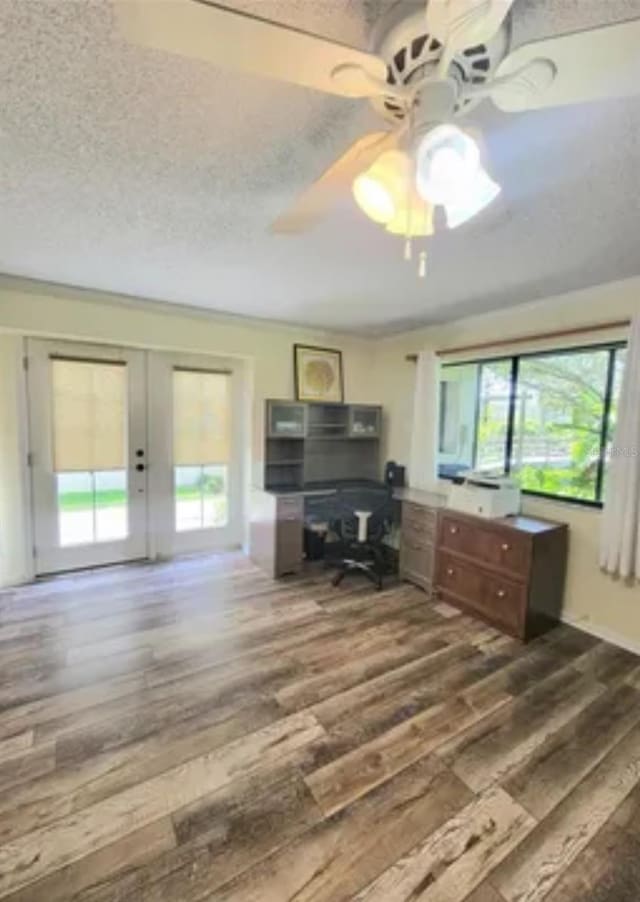 office space with ceiling fan, dark hardwood / wood-style floors, and a textured ceiling