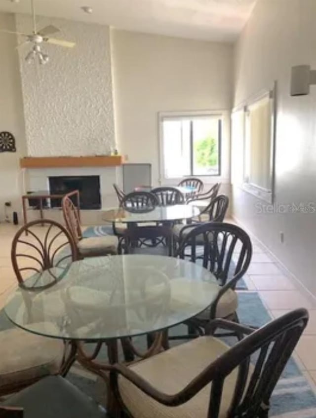 625 Duchess Blvd, Dunedin, FL 34698 - dining area featuring tile patterned flooring, a fireplace, and ceiling fan