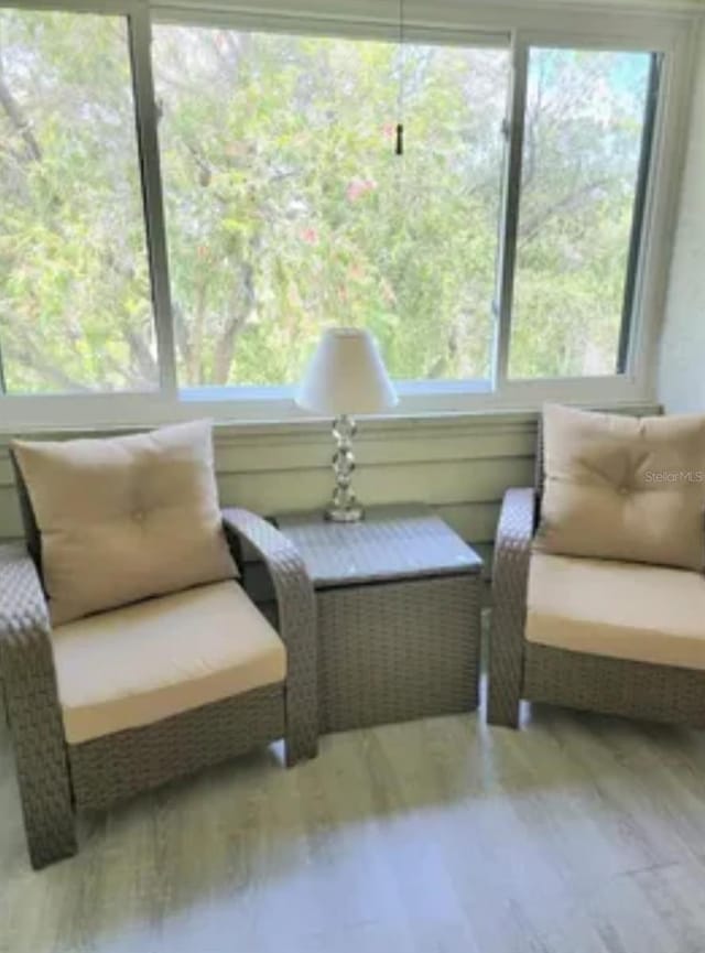 625 Duchess Blvd, Dunedin, FL 34698 - living area featuring healthy amount of natural light and wood finished floors