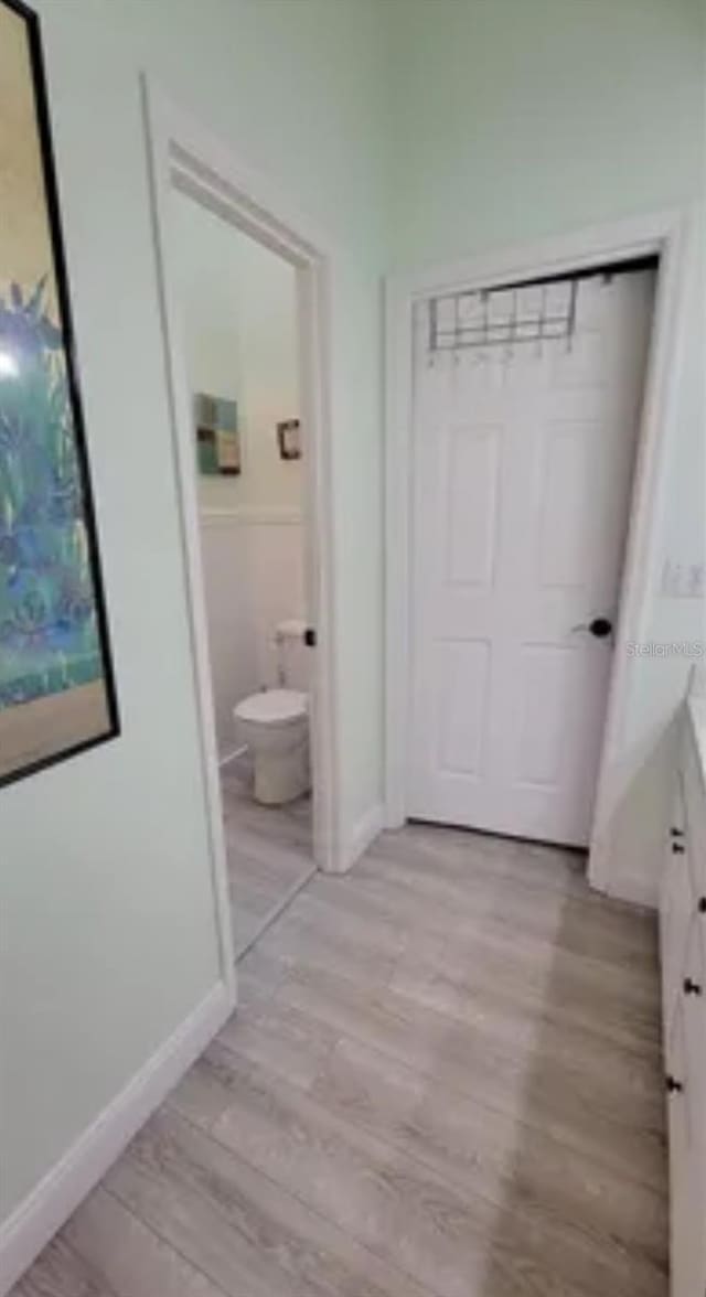 625 Duchess Blvd, Dunedin, FL 34698 - corridor featuring light wood-style flooring and baseboards