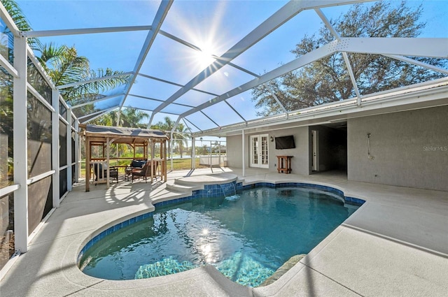 view of pool featuring french doors, a patio area, and glass enclosure