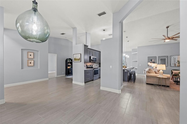 living room featuring high vaulted ceiling, ceiling fan, and light hardwood / wood-style flooring