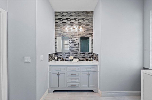 bathroom with vanity and backsplash