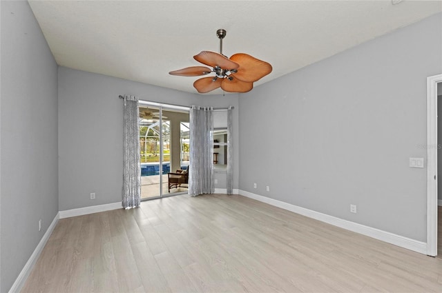 spare room with light hardwood / wood-style floors and ceiling fan