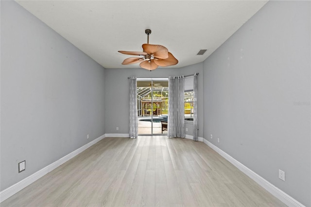 spare room featuring ceiling fan and light wood-type flooring