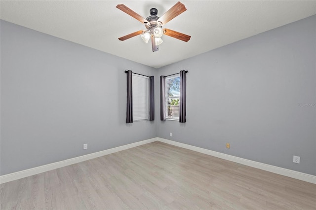 spare room featuring ceiling fan and light wood-type flooring