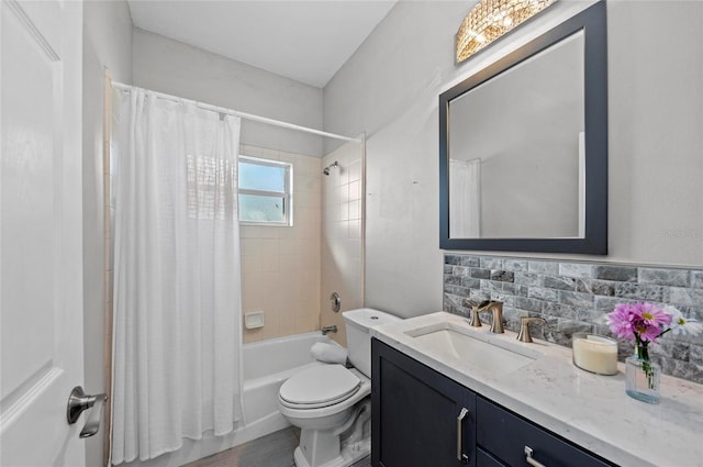 full bathroom with vanity, toilet, decorative backsplash, and shower / bath combo