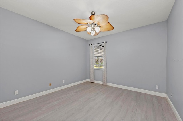 empty room featuring ceiling fan and light wood-type flooring