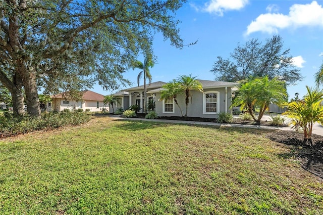 single story home featuring a front yard