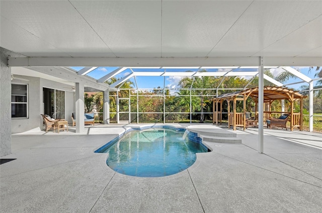 view of swimming pool featuring a lanai, pool water feature, and a patio area