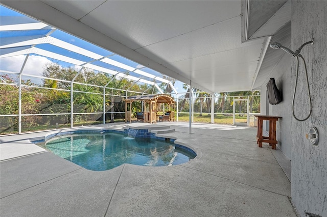 view of swimming pool with a patio area, pool water feature, a playground, and glass enclosure