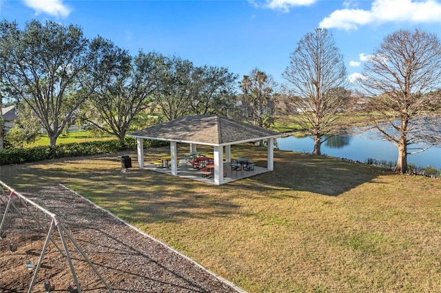 view of yard featuring a water view, a patio, and a gazebo