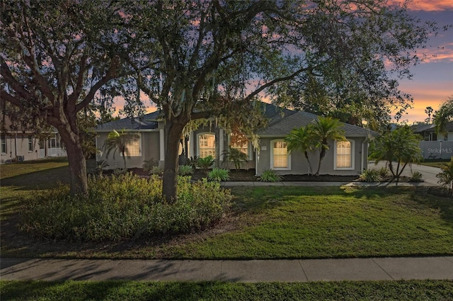 view of front of home with a yard