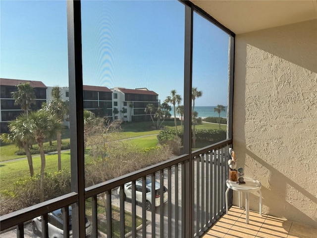 balcony featuring a water view