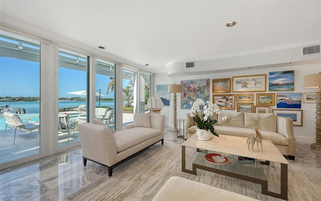 living room with ornamental molding, floor to ceiling windows, and a water view