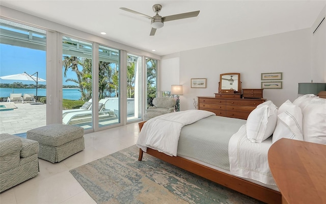 bedroom with a water view, ceiling fan, light tile patterned flooring, and access to outside