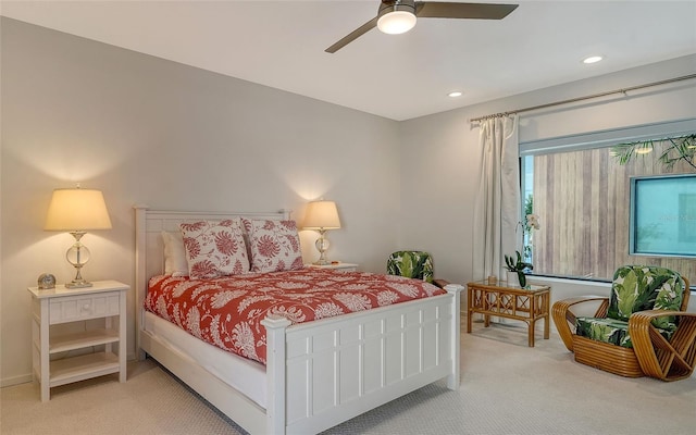 bedroom with ceiling fan and carpet flooring