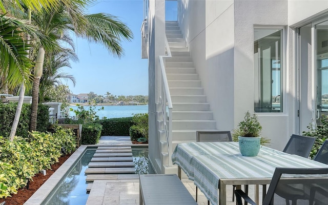 view of patio featuring a water view