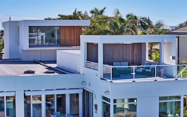 view of property exterior featuring an outdoor hangout area