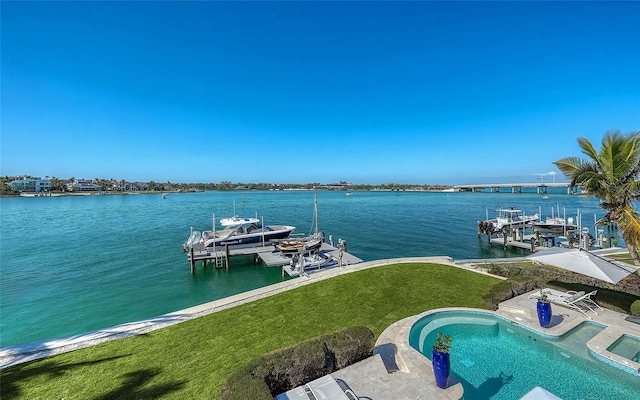 view of dock featuring a lawn and a water view