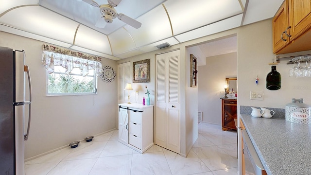 bathroom with ceiling fan and vanity