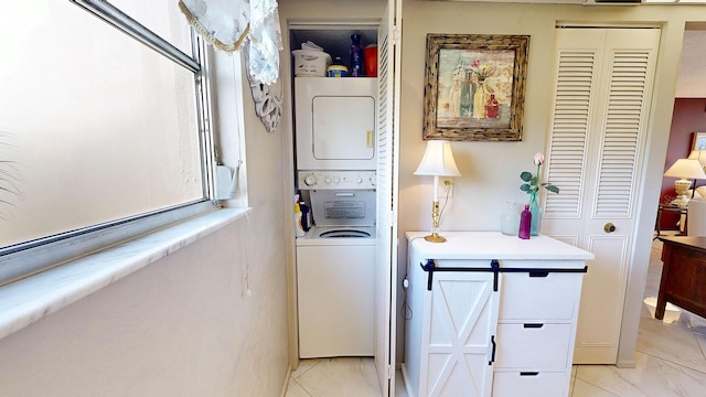 laundry room featuring stacked washer and dryer