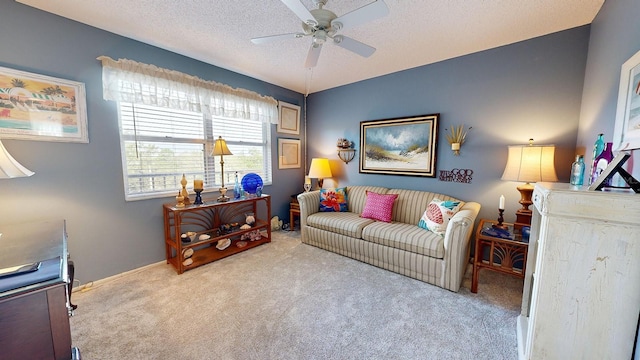 carpeted living room with ceiling fan and a textured ceiling