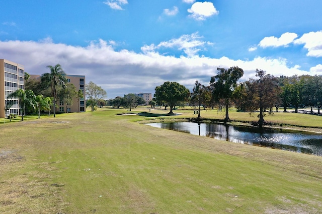 surrounding community featuring a yard and a water view