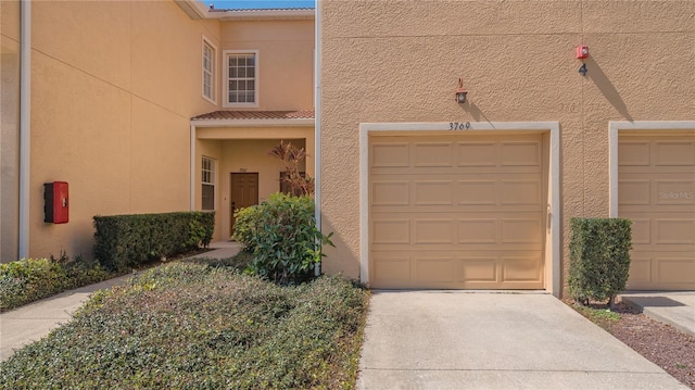 garage featuring driveway