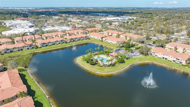 birds eye view of property featuring a water view and a residential view