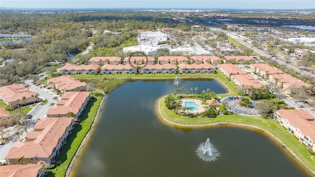 drone / aerial view with a residential view and a water view