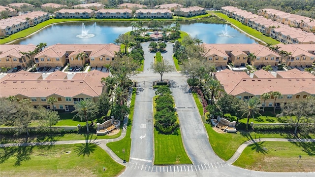 birds eye view of property featuring a water view and a residential view