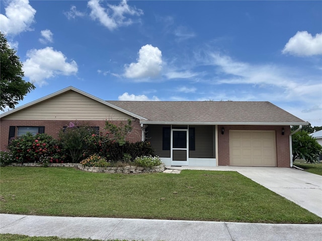 ranch-style house featuring a garage and a front yard