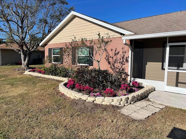 exterior space with a front lawn