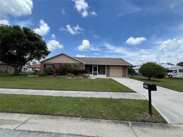 view of front facade with a garage and a front yard