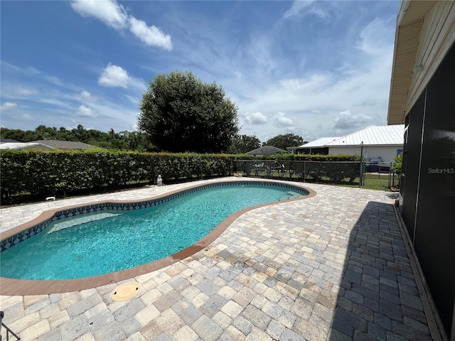 view of pool featuring a patio area