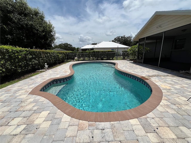 view of pool featuring a patio area