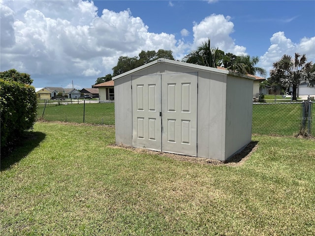 view of outdoor structure with a yard