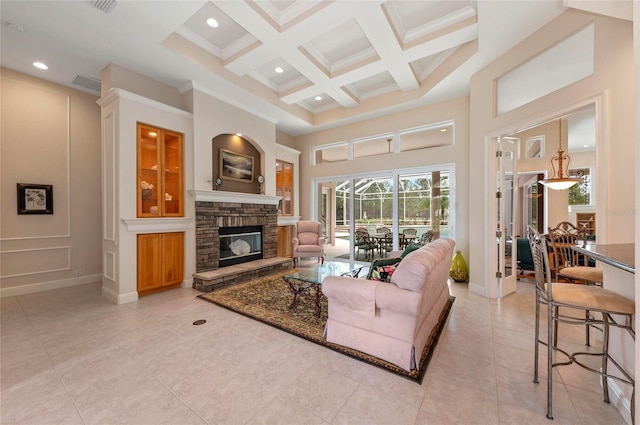 tiled living room featuring a fireplace, beamed ceiling, a towering ceiling, and coffered ceiling