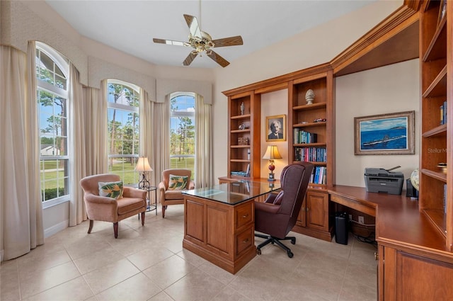 tiled office featuring ceiling fan