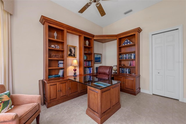 tiled office featuring ceiling fan