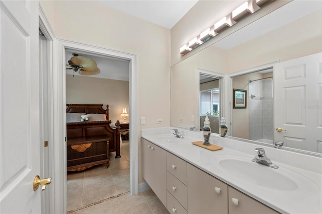 bathroom with tile patterned floors, ceiling fan, vanity, and walk in shower