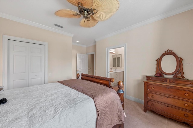 bedroom featuring a closet, ceiling fan, light tile patterned flooring, crown molding, and ensuite bathroom