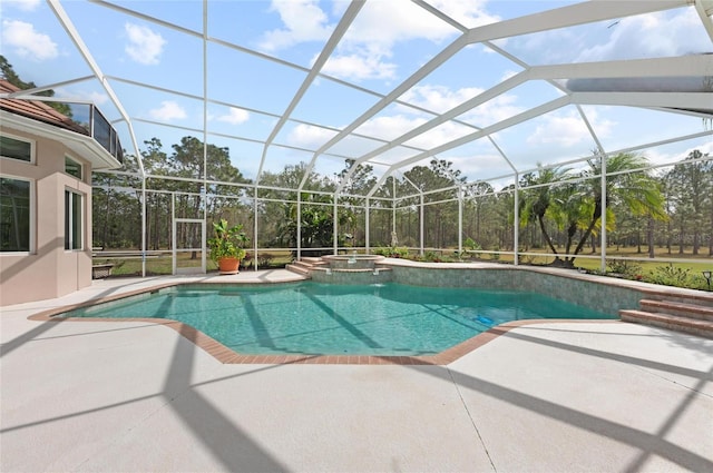 view of swimming pool with a patio area, an in ground hot tub, and a lanai