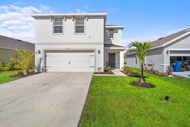 view of front of house featuring a garage and a front yard