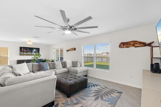 tiled living room featuring ceiling fan