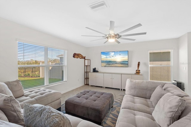 living room with light carpet and ceiling fan