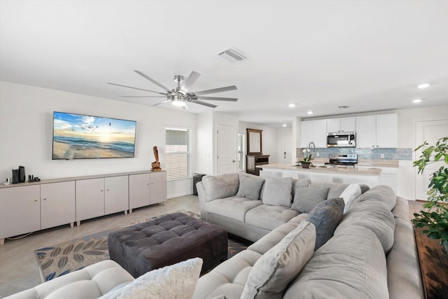 living room with ceiling fan