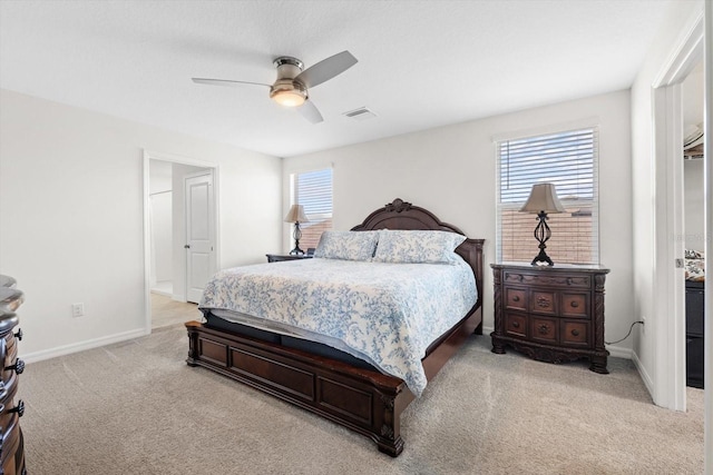 bedroom featuring ceiling fan and light colored carpet